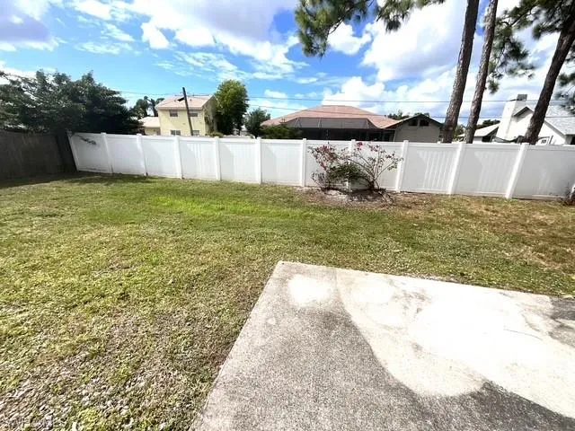 View of fenced backyard