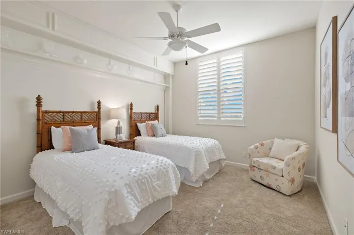 Bedroom featuring light carpet and ceiling fan