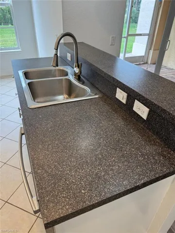 Interior details with sink and light tile patterned floors