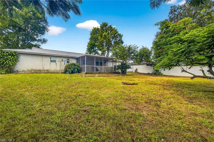 View of yard with a sunroom