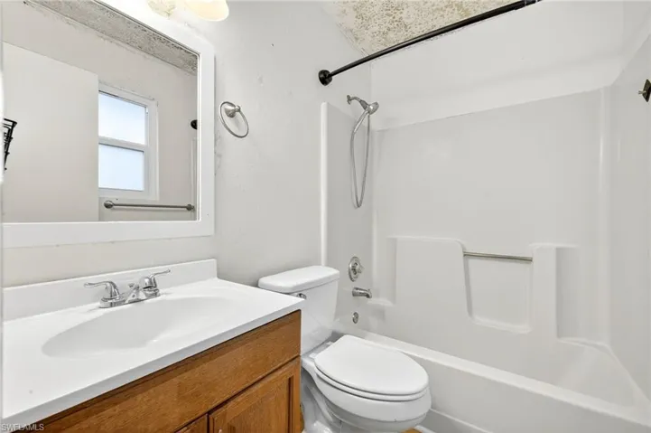 Bathroom with tub / shower combination and vanity