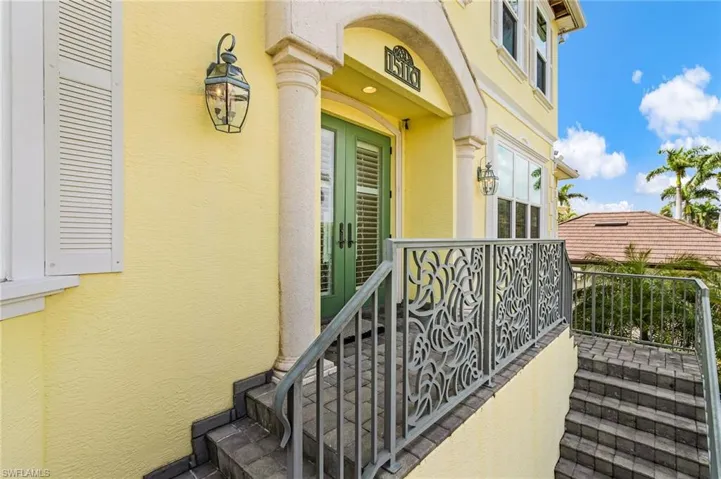 View of exterior entry with stucco siding