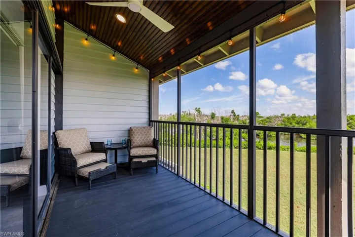 Unfurnished sunroom featuring wooden ceiling, vaulted ceiling, and ceiling fan