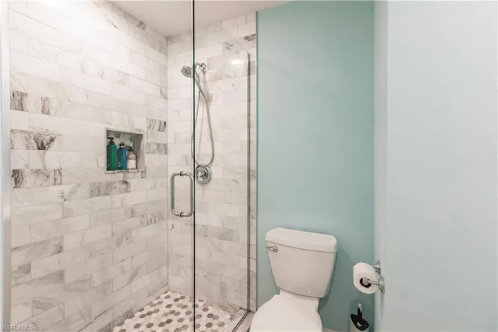 Bathroom with walk in shower and toilet
