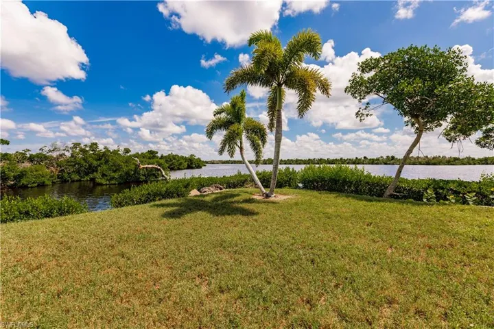 View of yard with a water view
