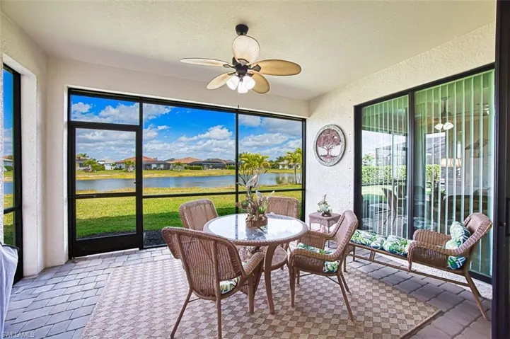 Lanai featuring a textured wall, a textured ceiling, a water view Northern exposure