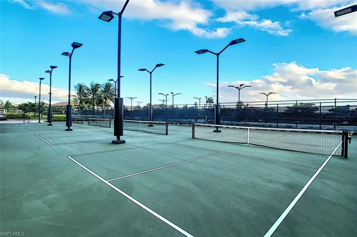 View of tennis court = also have lighted pickle ball courts and Bocce at the Town Center