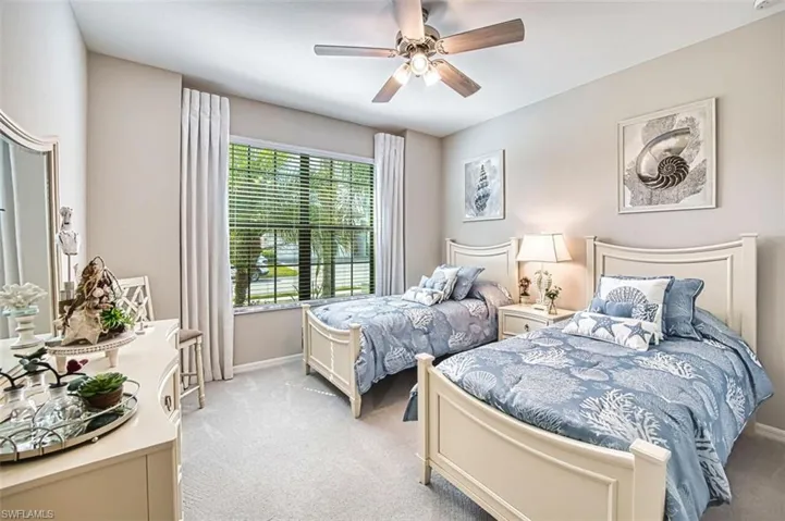 Bedroom featuring carpet and ceiling fan