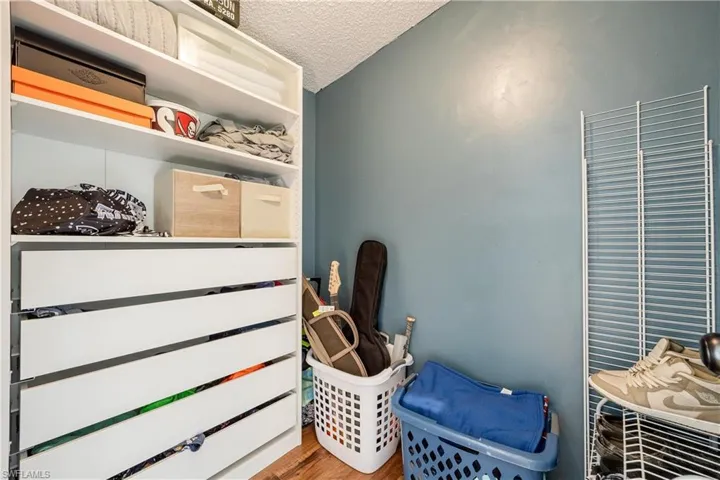 Spacious closet featuring wood-type flooring