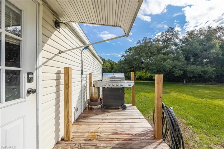 Deck with grilling area and a yard
