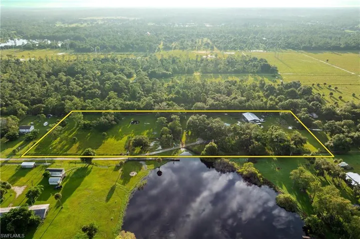 Aerial view featuring a water view and a rural view
