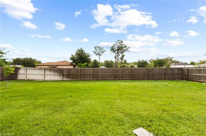 View of fenced backyard