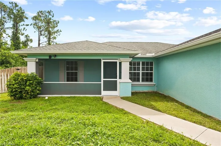 View of front of property featuring stucco siding and a shingled roof