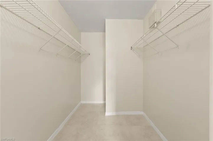 Spacious closet featuring light tile patterned floors