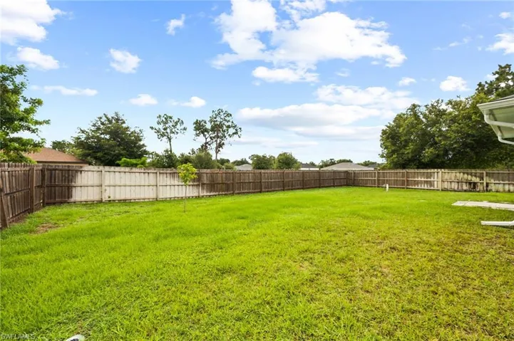View of fenced backyard
