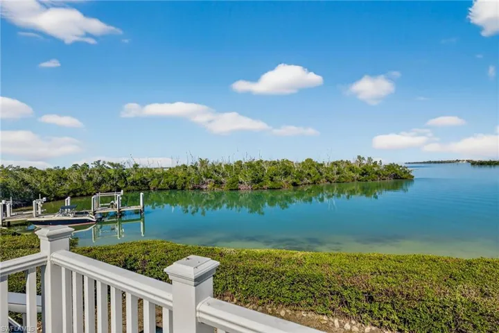 Water view featuring a dock and boat lift