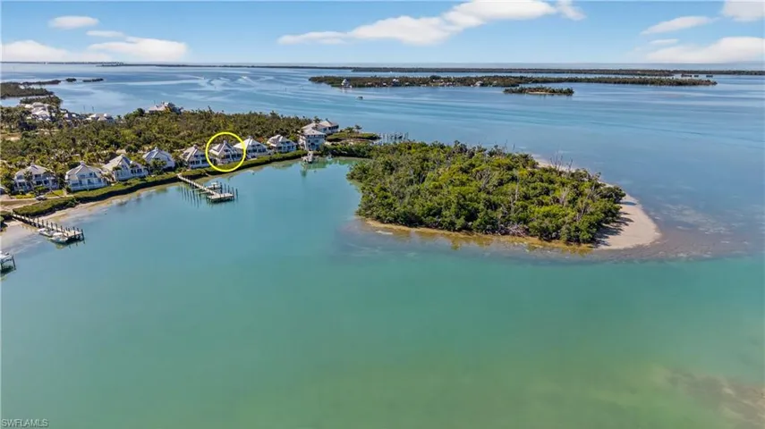 Aerial of The Village where this home is located showing the water surround