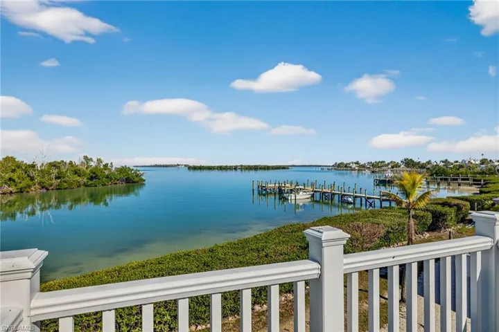 Deck of 2nd Floor bedroom with view across bay,, communal dock to the Main Marina in the distance