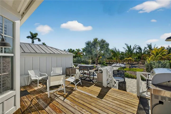Back deck, overlooking the entry drive ad open field.