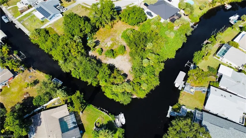 Aerial perspective of suburban area with a large body of water