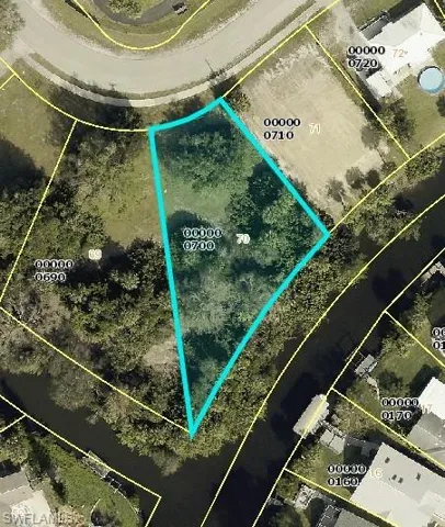 Aerial map of property and surrounding area featuring property parcel outlined