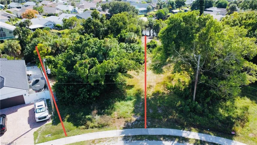 Aerial view of residential area with property parcel outlined