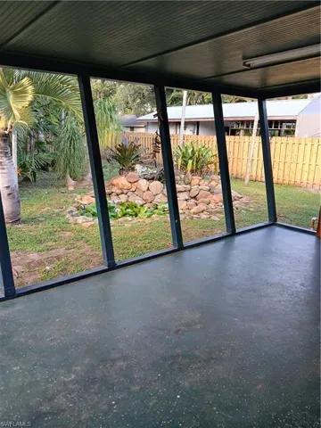 Rear Covered Open Porch with Backyard and Storage Shed