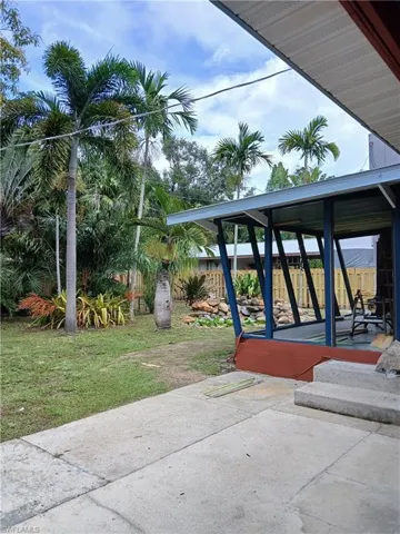 View of open patio and backyard