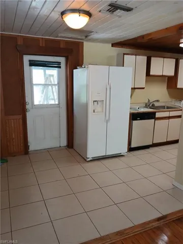 Kitchen & Dining area with access to rear covered Porch