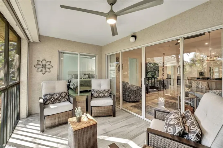 Sunroom featuring ceiling fan