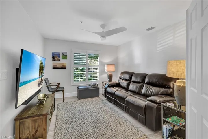 Living room featuring light hardwood / wood-style flooring and ceiling fan