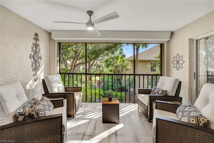 Sunroom featuring ceiling fan