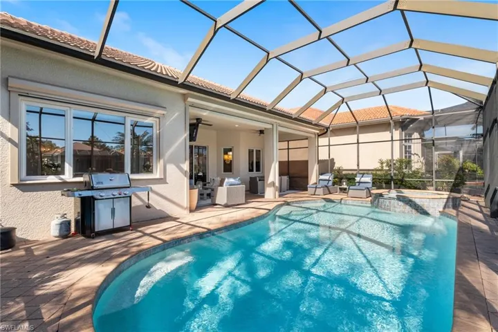 View of swimming pool & bbq grill