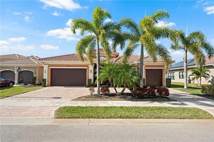 Mediterranean / spanish-style home with a garage