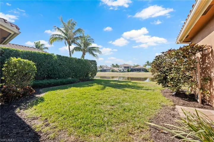 View of yard with a water view