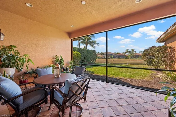 Sunroom / solarium with a water view