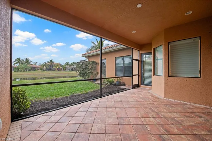 Unfurnished sunroom with a water view and a healthy amount of sunlight