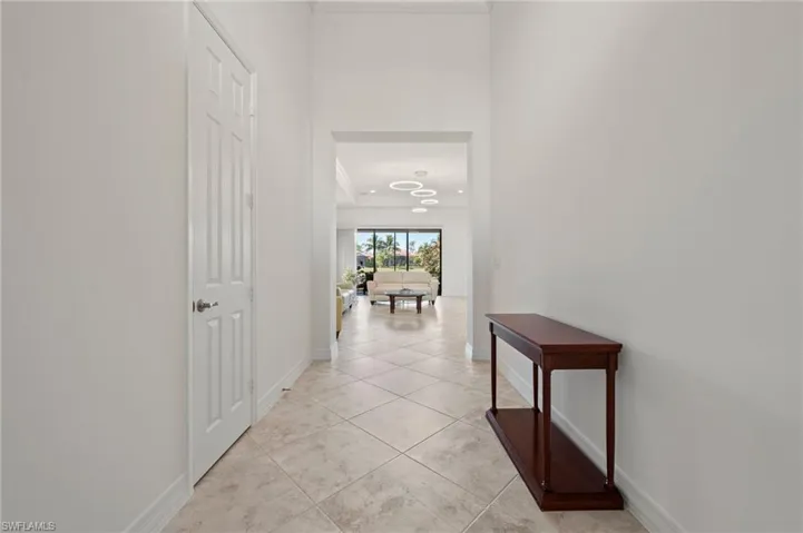 Hallway with light tile patterned floors
