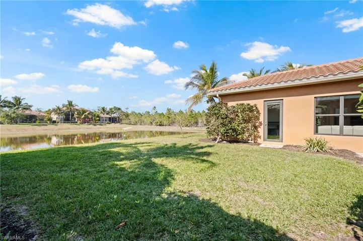 View of yard with a water view