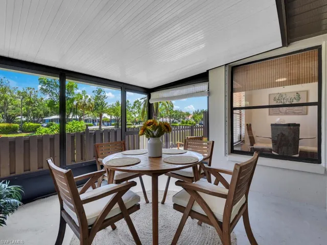 Sunroom featuring lofted ceiling