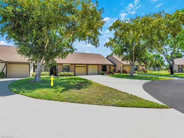 Single story home with a front lawn and a garage
