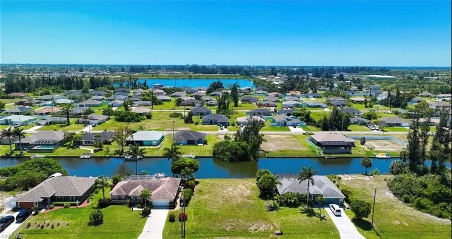 Aerial view of residential area with a large body of water