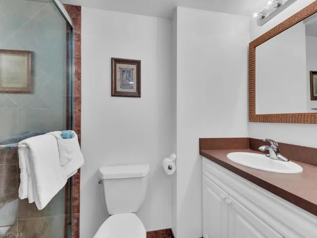 Bathroom featuring vanity and walk in shower