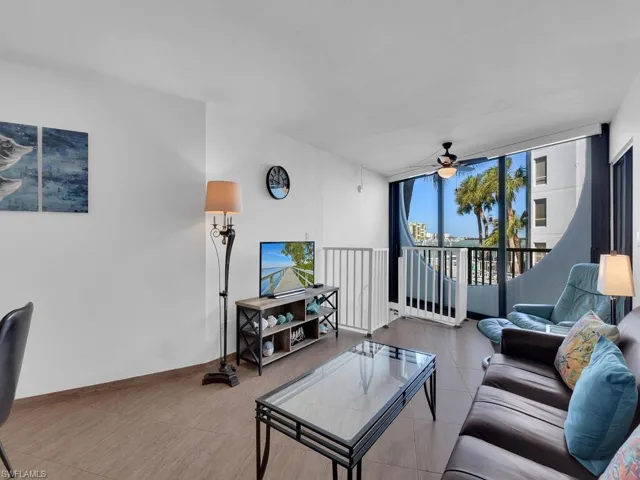 Living room featuring floor to ceiling windows