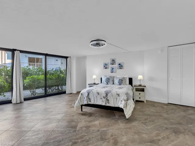 Cabana featuring expansive windows and access to exterior