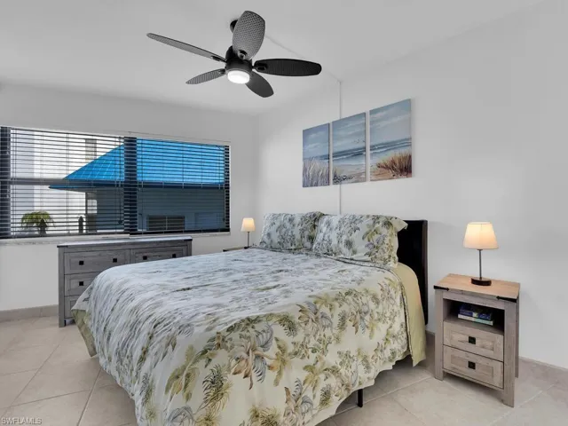 Bedroom featuring ceiling fan and light tile patterned flooring