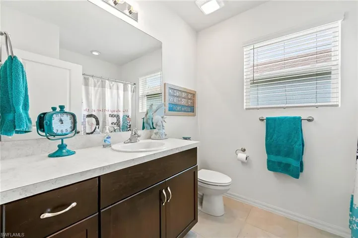 Second bathroom has a large vanity and has a tub/shower combo