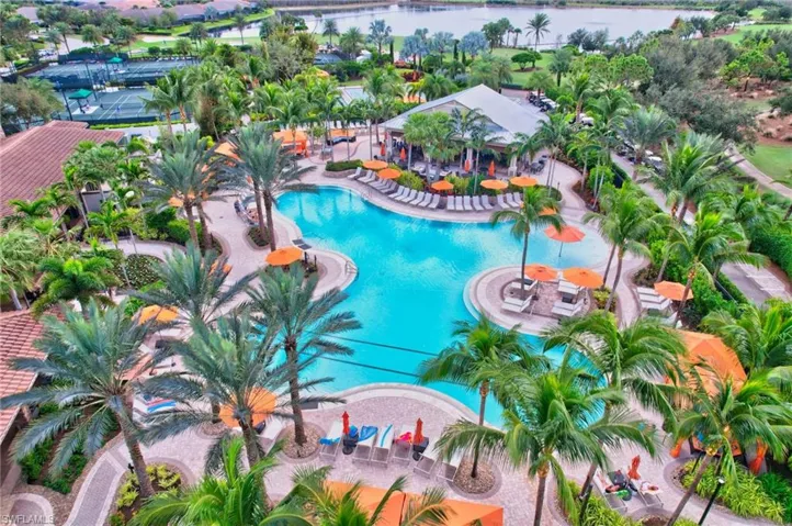 View of resort style pool with a water view