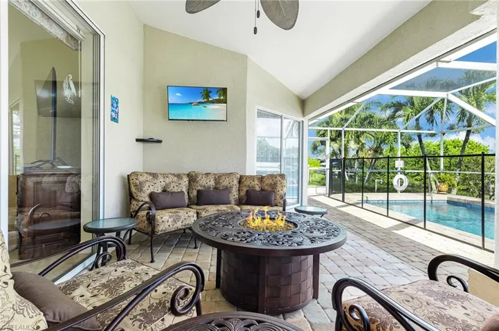View of patio / terrace with a sunroom, an outdoor pool, a lanai, and an outdoor hangout area