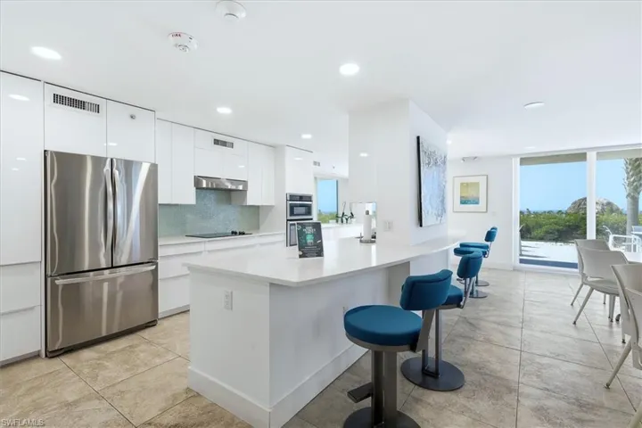 Community Kitchen with access to the patio and pool